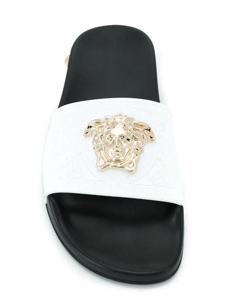 white versace pool slides.